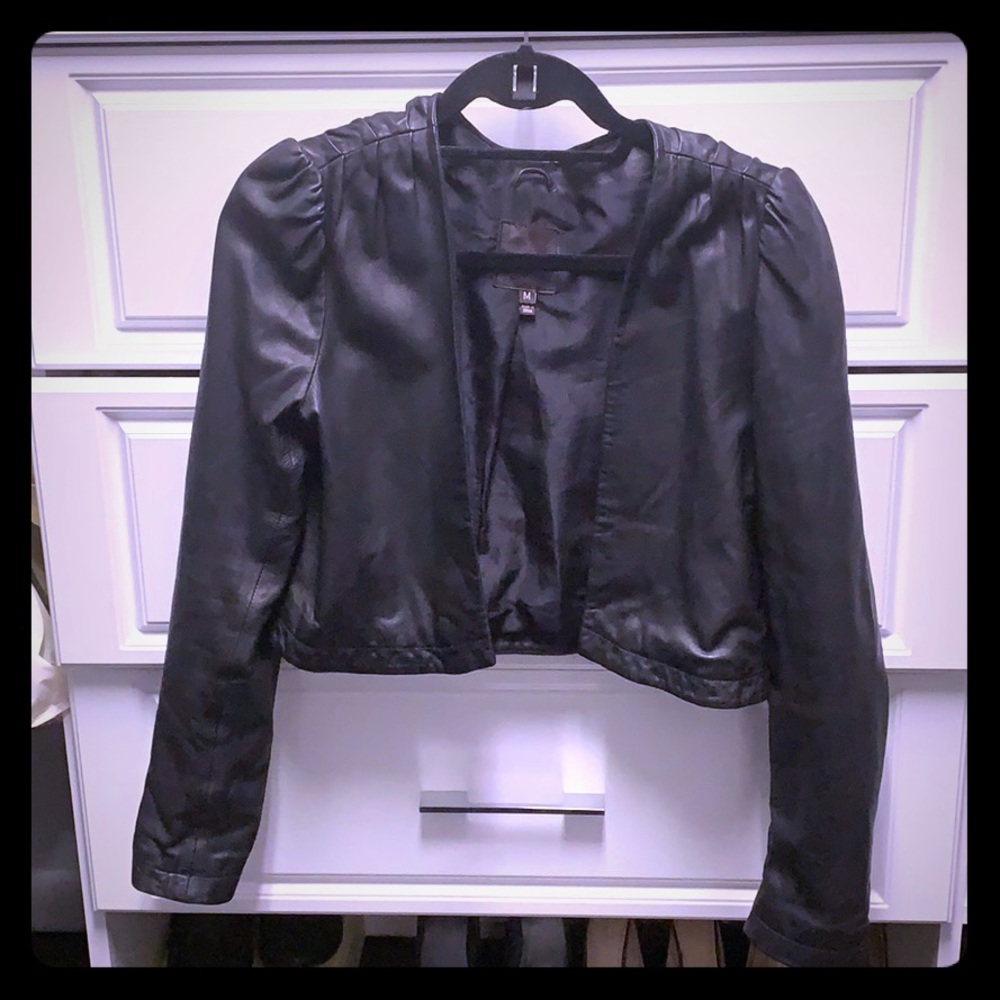 Cropped light leather jacket.